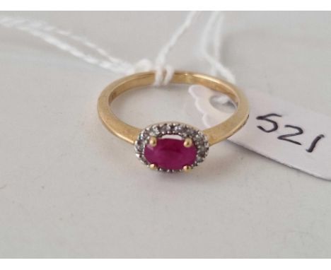 A ruby and diamond cluster ring 9ct size M