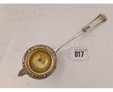An Art Deco style Continental (800 standard) tea strainer with gilt bowl, 7.5" long, 50g
