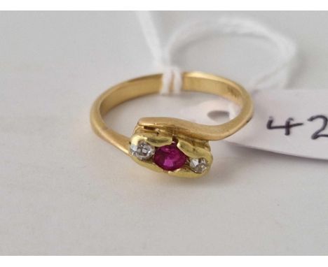 A ruby and diamond three stone cross over ring 18ct gold size L