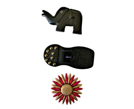 3 Large 20th century buttons including an unusual example.This small card has a colorful and cool sunburst celluloid or plast