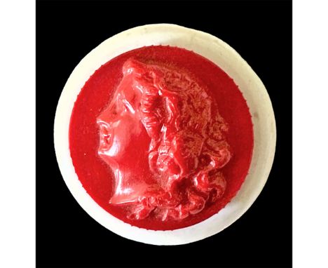 1 Medium size red and white "Colt" manufacturing button.Here is the desirable rouge button that collectors seek after, not on