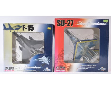 Two original Witty Wings diecast model planes comprising; F-15 1:72 scale and SU-27 1;72 scale. Both in their original boxes.