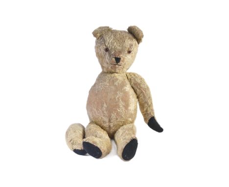 A large vintage soft toy teddy bear, likely a Chad Valley / Chiltern example. Golden mohair with beaded eyes, pronounced snou