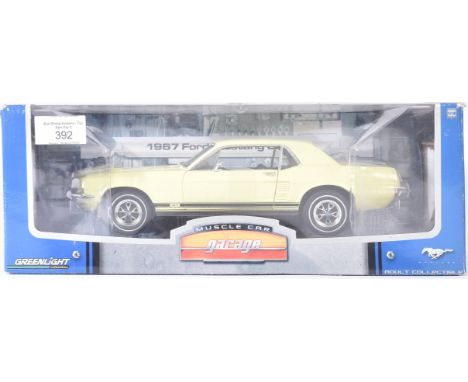 An original Greenlight Collectibles 1/18 scale boxed diecast model No. 12806 1967 Ford Mustang Coupe. Contents appearing mint