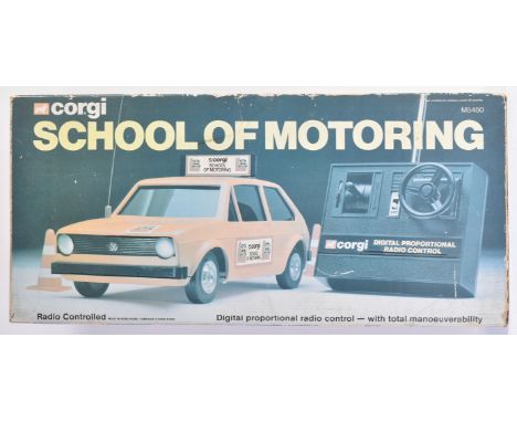 A vintage Corgi ' School of Motoring ' RC Radio Control model car. The set containing the orange car, transmitter, bollards, 