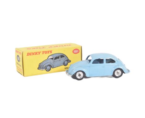 An original vintage Dinky Toys diecast model No. 181 Volkswagen Beetle car. Light blue exterior with black tyres and chrome h