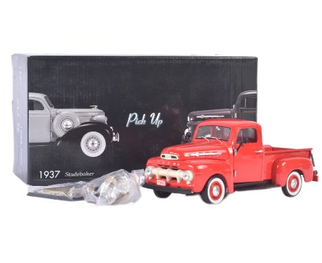 A vintage Unique Replicas 1/24 scale boxed diecast model No. 79003 Ford Pick Up in red with detachable tonneau cover. Appeari