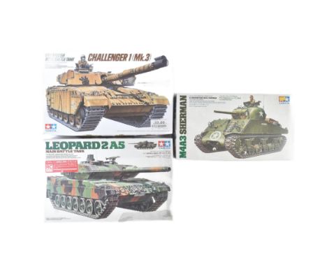 A collection of x3 assorted 1/35 scale Tamiya plastic model kits of Military interest comprising; 35122 M4A3 Sherman Tank, 35