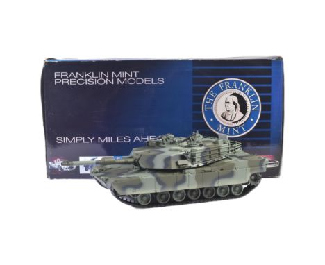 An original Franklin Mint 1/24 scale boxed diecast model of an M1A1 Abrams Tank. The model appearing mint with original box a