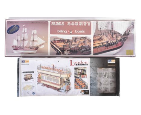Wooden model kits - x2 wooden model kits comprising 1/24 scale Ocio Creativo / OcCre London Tram Car and a Billing Boats 1/50