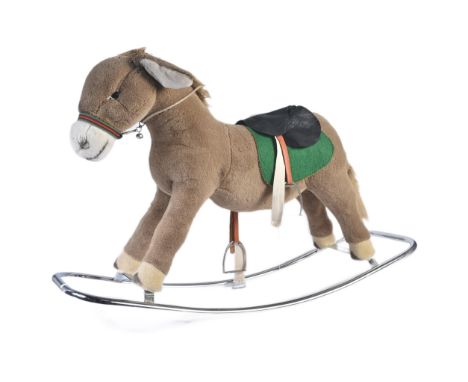 A vintage Merrythought ride-along rocking horse / donkey. Light brown plush with leatherette saddle, stirrups and reins. Moun