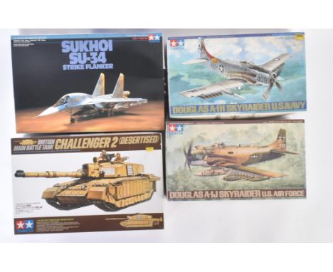 A collection of x4 assorted Tamiya plastic model kits to comprising; 1/35 scale British Challenger 2 Tank, 1/72 scale Sukhoi 