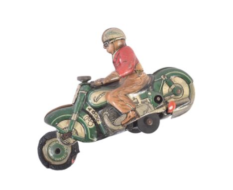 A vintage 1950s Schuco made tinplate clockwork model of a motorcycle ' Curvo 1000 '. Green with red/brown driver figure weari