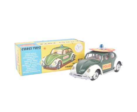 A vintage Corgi Toys diecast model No. 492 Volkswagen European Police Car. The model with dark green and white body, lifting 