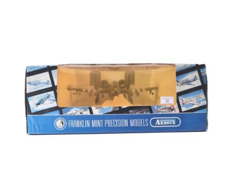 An original Franklin Mint Armour Collection 1/48 scale boxed diecast model of a USAF A10 Warthog jet plane. Contents appearin