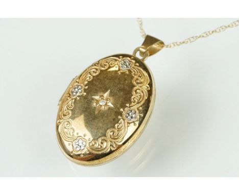 Diamond 9ct yellow gold and white gold set oval locket pendant necklace, small round brilliant cut diamond to centre, gypsy s