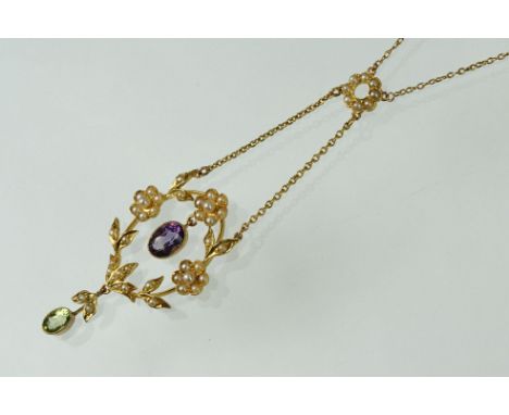 Early 20th century Suffragette pendant necklace, three seed pearl set flower head clusters, seed pearl set leaf motifs, oval 