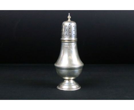 George VI silver sugar caster of baluster form, gadrooning to the waist and moulded circular foot, ogee finial, makers James 
