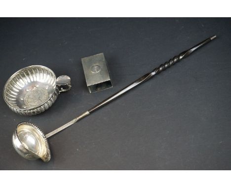 A Georgian white metal toddy ladle with George I shilling to the centre, baleen handle; together with a white metal porringer