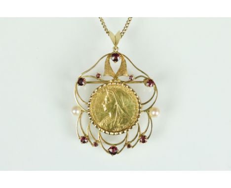 Victorian 1900 full sovereign coin set into an Edwardian open work pendant set with two pearls and round cut rubies. The pend