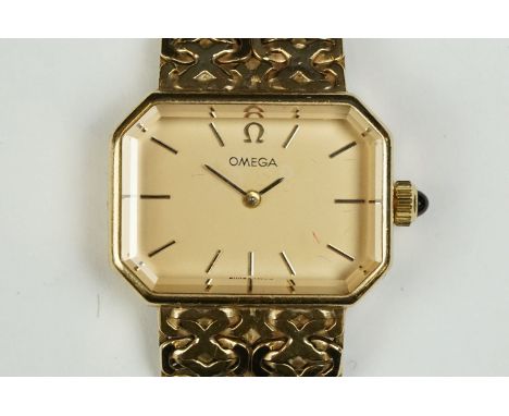 Omega 9ct gold ladies wrist watch. The watch having a gilt face with baton markings to the chapter ring and bevelled glass se