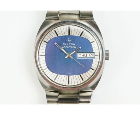 Bulova Accutron tuning fork movement wrist watch. The watch having a blue face with baton markings to the silvered chapter ri