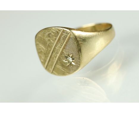 Diamond 9ct yellow gold signet ring, the rounded square head set with small round eight cut diamond, gypsy set, engraved foli