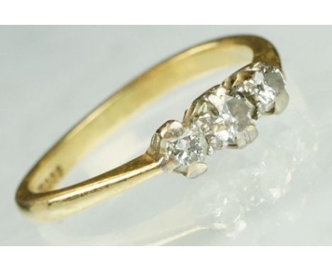 Diamond three stone 18ct yellow gold ring, three graduated round brilliant cut diamonds, claw illusion set, tapered shoulders