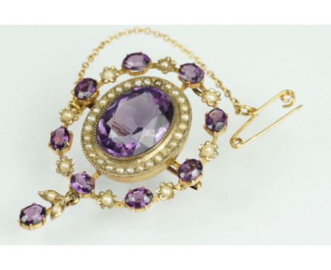 Early 20th century amethyst and seed pearl yellow metal pendant brooch, the principal amethyst measuring approx 15.5mm x 12mm