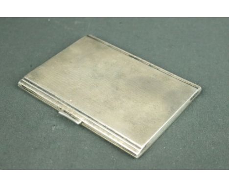 1930s Art Deco silver hallmarked cigarette case having an engine turned exterior with stepped sides and a gilt interior. Hall