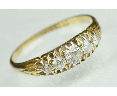 Edwardian diamond 18ct yellow gold five stone boat head ring, five graduated old round brilliant cut diamonds, the principal 