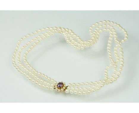 Cultured pearl triple strand necklace with amethyst and pearl 9ct gold clasp, the white cultured pearls diameter approx 5.5mm