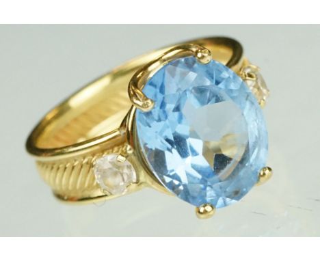 Blue topaz and white stone ring, the band stamped 750, textured band, ring size K½ 