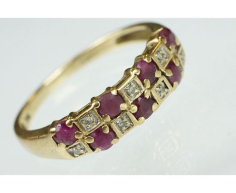 9ct gold hallmarked ruby and diamond ring. The ring being set with seven round cut rubies and seven round cut diamonds in squ