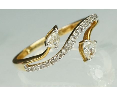 Diamond 14ct yellow gold ring, two pear shaped diamonds, claw set, dimensions approx 2.5mm x 3.5mm, claw set, nineteen small 
