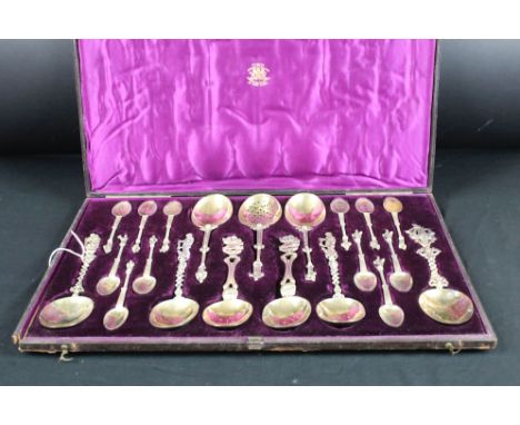 Set of anointing spoons and apostle finial spoons, parcel gilt, various sizes and marks, 20 in total, in original retailers c