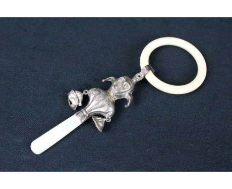 Silver and mother-of-pearl baby rattle teether modelled as a jester with bells, tapered mother-of-pearl handle, plastic teeth