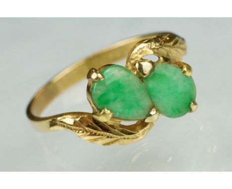 Jade 22ct yellow gold two stone ring, two pear shaped cabochon cut jade panels, dimensions approx 6.5mm x 5mm, claw set, cros