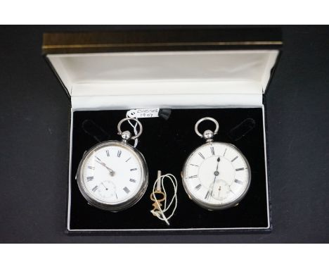 Two 19th Century Victorian silver hallmarked open face pocket watches. Both watch having a round white enamelled dial with ro