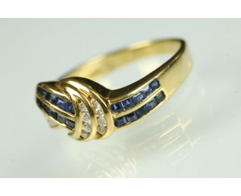 Diamond and sapphire 18ct yellow gold ring, twenty small square cut sapphires, nineteen small round brilliant cut diamonds, c