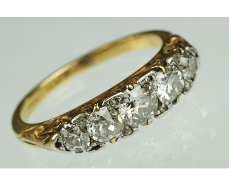 Early 20th century diamond five stone yellow gold and platinum set ring, five graduated old round brilliant cut diamonds, the