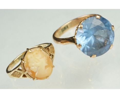 Blue stone rose metal ring, the blue stone possibly paste or synthetic spinel, claw set, ring size O½; together with a cameo 