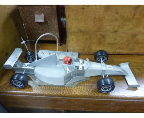 An unusual ceiling light in the form of an F1 racing car 