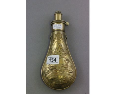 Vintage brass powder flask decorated with deer and hounds