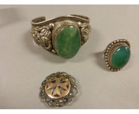 Silver Bangle and Ring both set with green polished stone marked 925 together with a Brooch marked 900