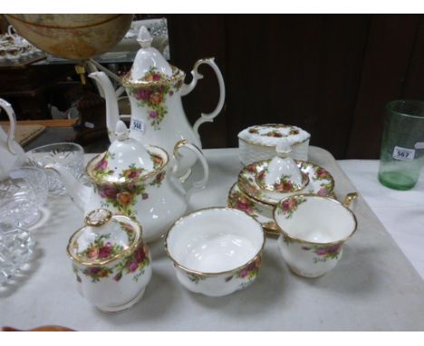 Quantity of Royal Albert Country Roses china to include teapot, coffee pot, cups saucers etc