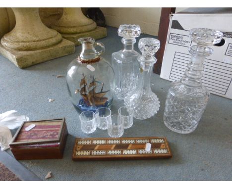 Ship in a Glass Bottle, Bone and Wooden Inlaid Cribbage Board, Three Glass Decanters, Four Glasses and a Small Box