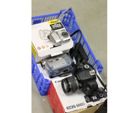 Two digital cameras to include Canon EOS 600D with lens and Nikon Coolpix 3100 plus a Canon video camera