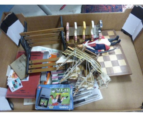 Mixed lot to include boxed Casio TV, miniature bench, ceramic toast rack, pens etc