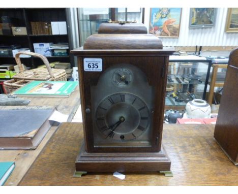 Oak Cased Bracket Clock with silvered face and fast / slow dial
